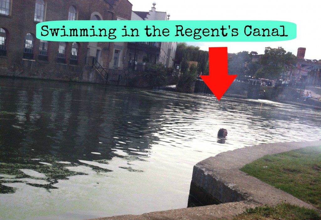 A man swimming in the Regents Canal near Camden